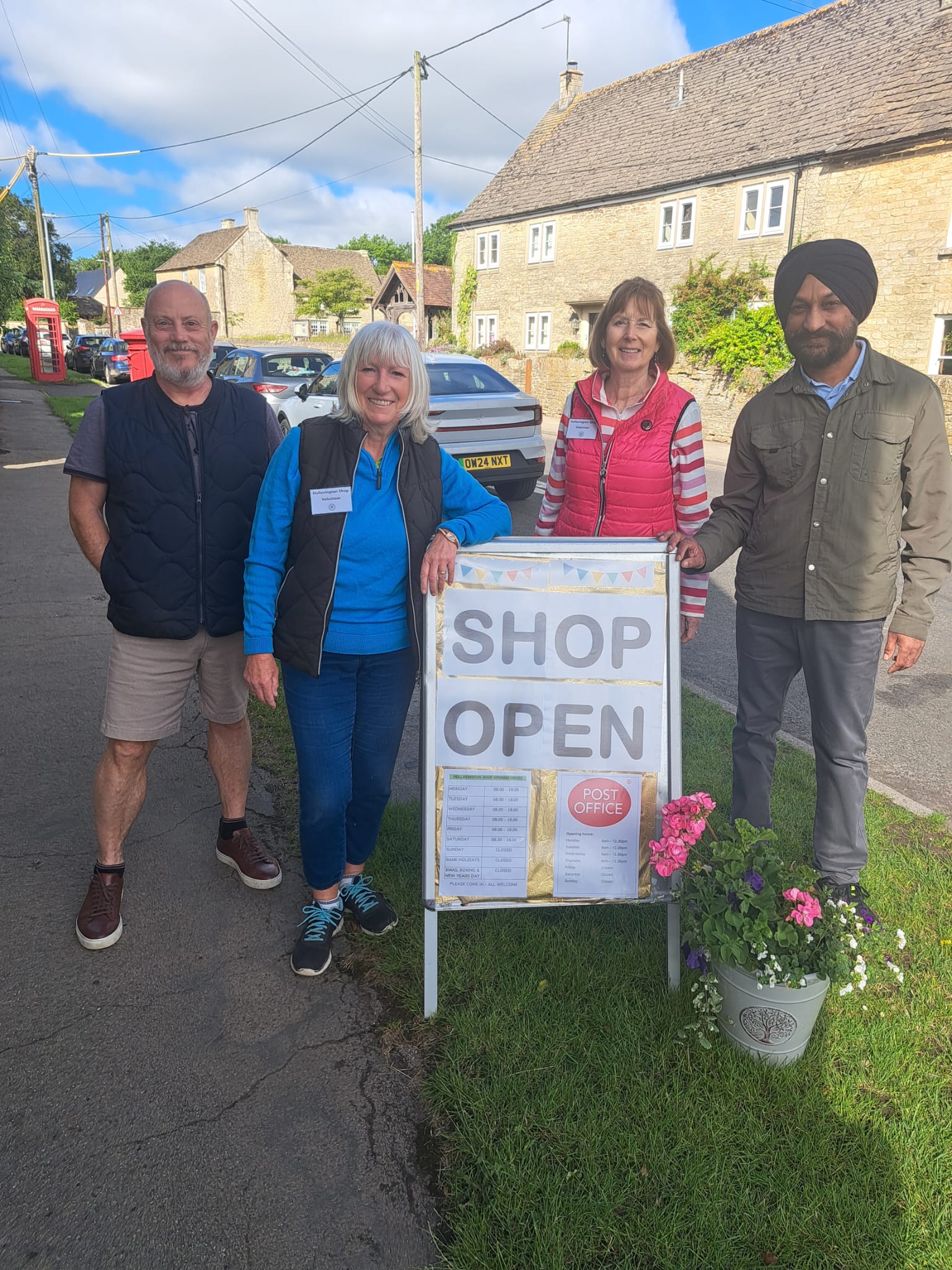 Photograph outside the shop with 4 customers